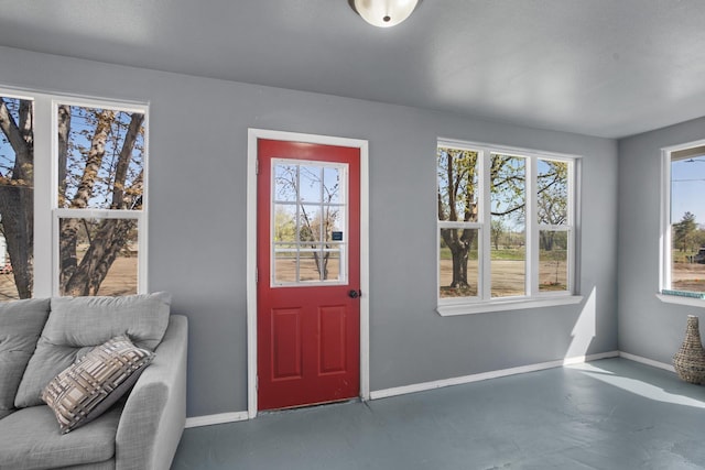 706 E Central Ave, Minot, ND 58701 - entryway featuring baseboards and concrete flooring