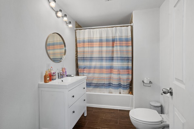 706 E Central Ave, Minot, ND 58701 - full bathroom featuring wood finished floors, shower / bath combination with curtain, vanity, and toilet