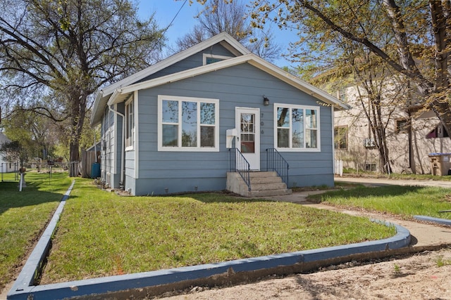 706 E Central Ave, Minot, ND 58701 - view of front facade featuring a front lawn and entry steps