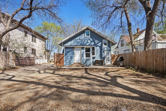 706 E Central Ave, Minot, ND 58701 - rear view of house with fence