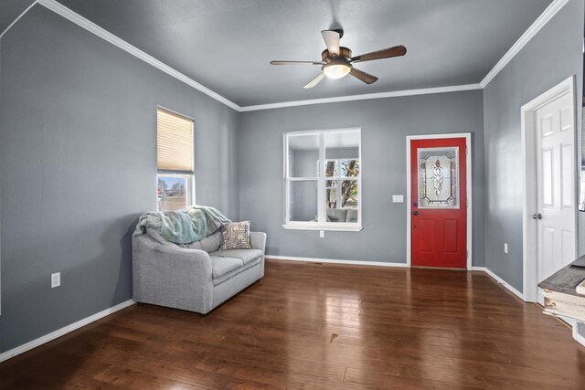 706 E Central Ave, Minot, ND 58701 - entryway featuring ceiling fan, healthy amount of natural light, wood finished floors, baseboards, and ornamental molding