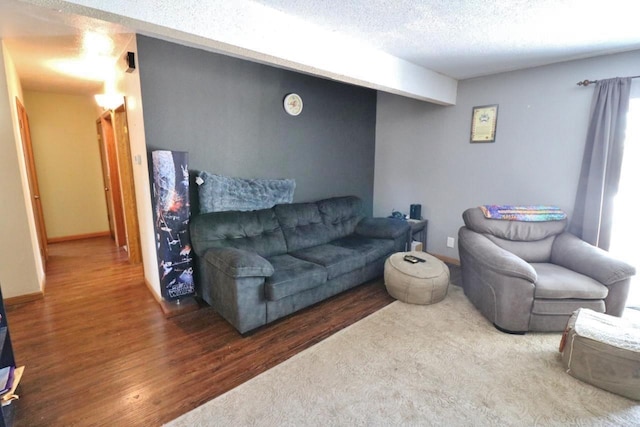 306 Davis St, Burlington, ND 58722 - living area with wood finished floors and a textured ceiling