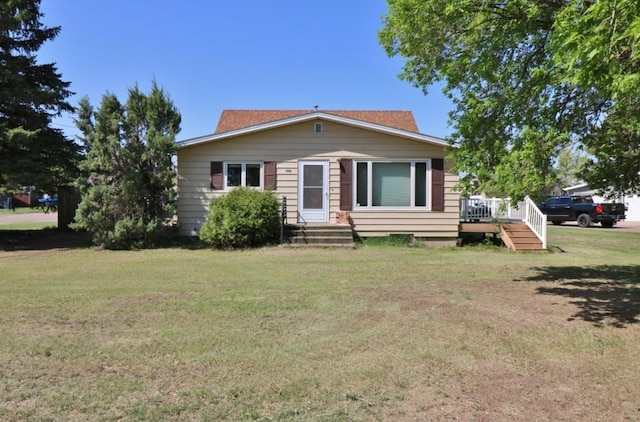 306 Davis St, Burlington, ND 58722 - bungalow-style home with a front lawn and a wooden deck