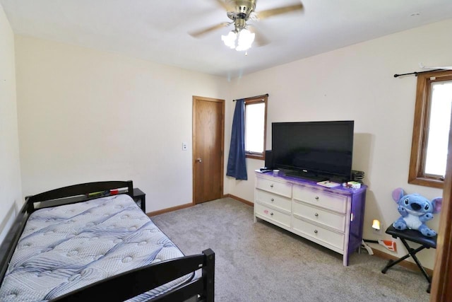 306 Davis St, Burlington, ND 58722 - carpeted bedroom featuring multiple windows, baseboards, and ceiling fan