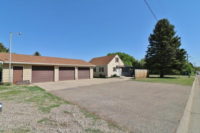 306 Davis St, Burlington, ND 58722 - view of front of home with driveway and an attached garage
