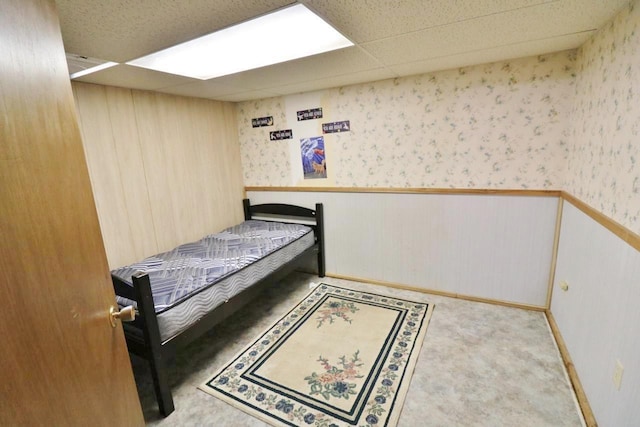 306 Davis St, Burlington, ND 58722 - bedroom with wainscoting, wallpapered walls, and carpet