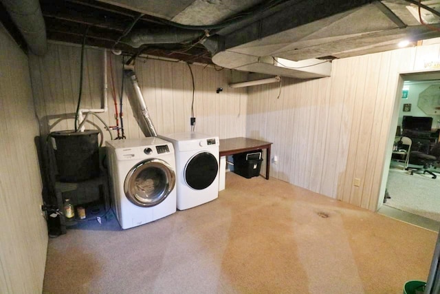 306 Davis St, Burlington, ND 58722 - laundry room featuring washer and clothes dryer, wood walls, and carpet flooring