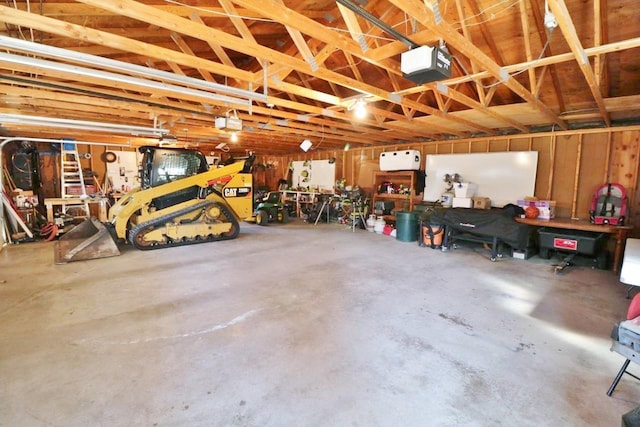 306 Davis St, Burlington, ND 58722 - garage with a garage door opener and a workshop area