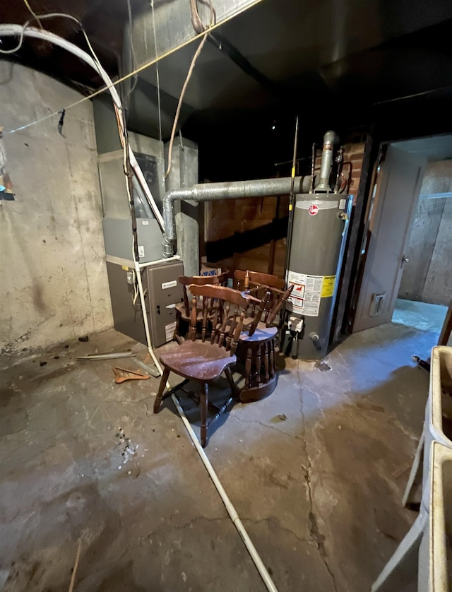 909 NW 10th Ave, Minot, ND 58703 - utility room featuring water heater and heating unit
