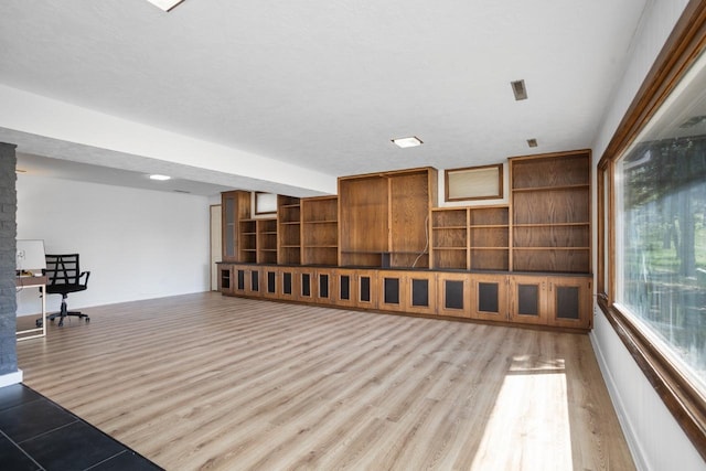 4401 38th St, Minot, ND 58701 - basement featuring wood finished floors and baseboards