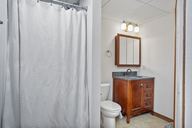 4401 38th St, Minot, ND 58701 - full bath with toilet, a drop ceiling, vanity, and a shower with shower curtain
