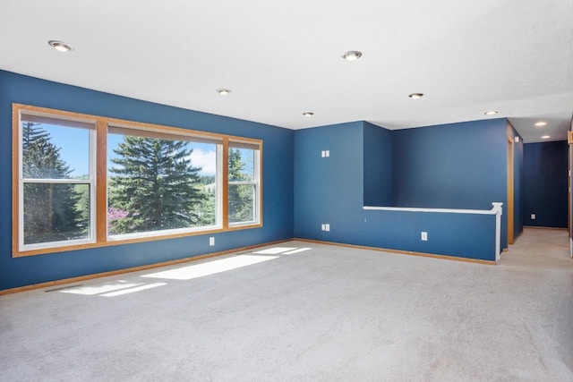 4401 38th St, Minot, ND 58701 - carpeted empty room featuring baseboards and recessed lighting