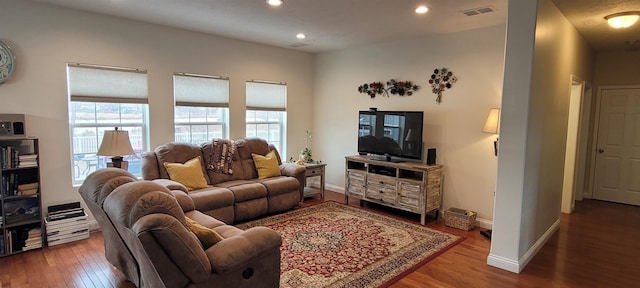1728 Rivers Edge, Minot, ND 58701 - living area with wood finished floors, recessed lighting, and baseboards
