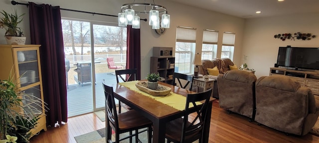 1728 Rivers Edge, Minot, ND 58701 - dining space with plenty of natural light, wood finished floors, a chandelier, and recessed lighting