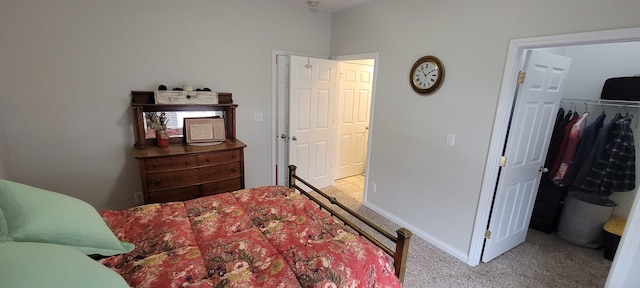 1728 Rivers Edge, Minot, ND 58701 - carpeted bedroom featuring a closet and baseboards