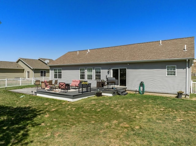 1728 Rivers Edge, Minot, ND 58701 - rear view of house with an outdoor hangout area and roof with shingles