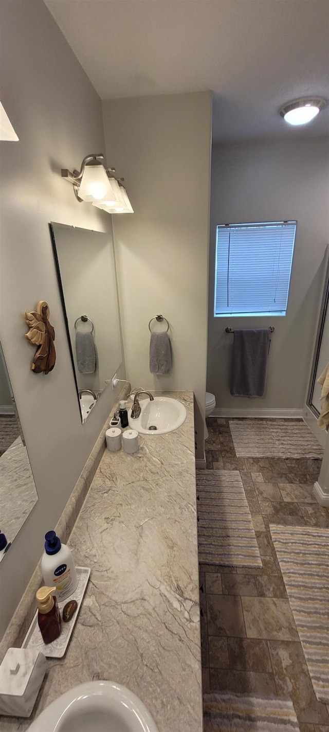 1728 Rivers Edge, Minot, ND 58701 - bathroom with toilet and vanity