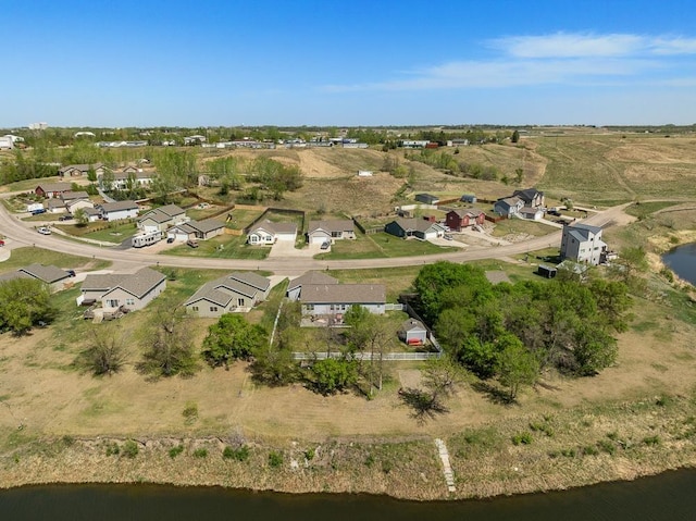1728 Rivers Edge, Minot, ND 58701 - aerial view of property and surrounding area with a nearby body of water