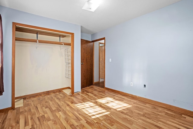 3574 91st St, Mohall, ND 58761 - unfurnished bedroom with light wood-style flooring, a closet, and baseboards