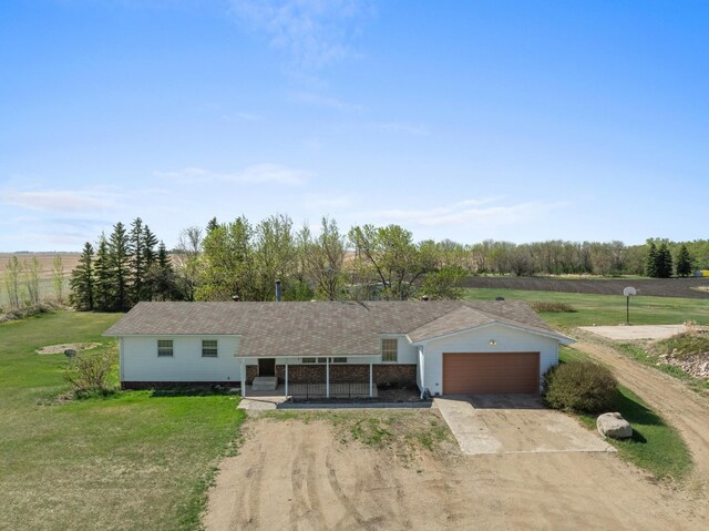 3574 91st St, Mohall, ND 58761 - ranch-style house featuring concrete driveway, an attached garage, and a front lawn
