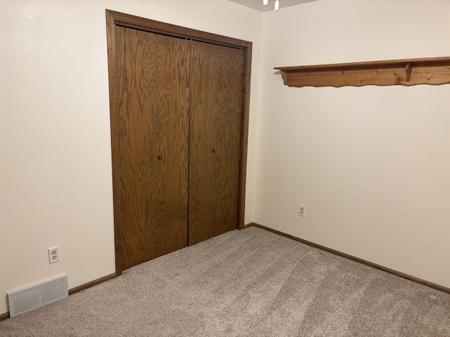 2420 8th St Unit 2420, Minot, ND 58703 - unfurnished bedroom with carpet and baseboards