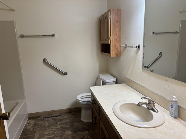 2420 8th St Unit 2420, Minot, ND 58703 - full bath with toilet, vanity, and baseboards