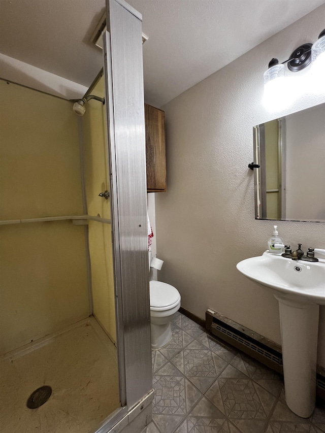 410 6th Ave, Minot, ND 58703 - full bathroom featuring a stall shower, toilet, baseboard heating, baseboards, and a sink