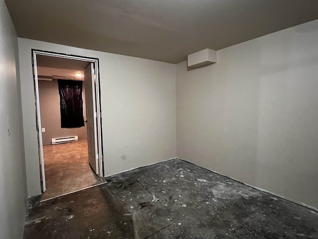410 6th Ave, Minot, ND 58703 - empty room with baseboard heating and concrete floors