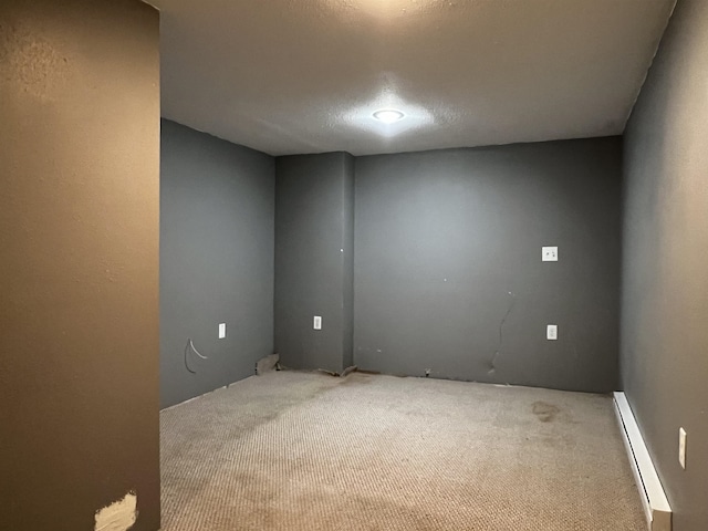 410 6th Ave, Minot, ND 58703 - empty room with a baseboard radiator and carpet floors