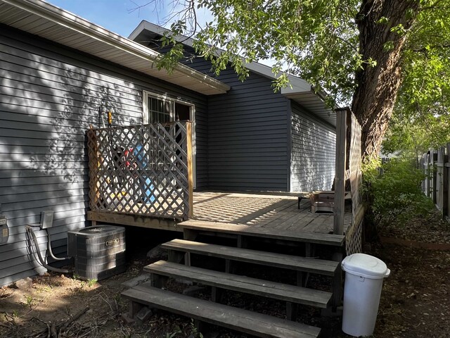 410 6th Ave, Minot, ND 58703 - wooden terrace featuring central air condition unit
