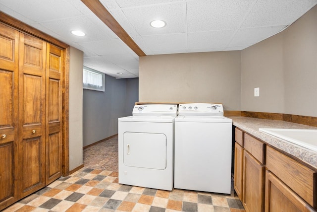 1309 1st St, Minot, ND 58701 - clothes washing area featuring washer and dryer, cabinet space, recessed lighting, and light flooring