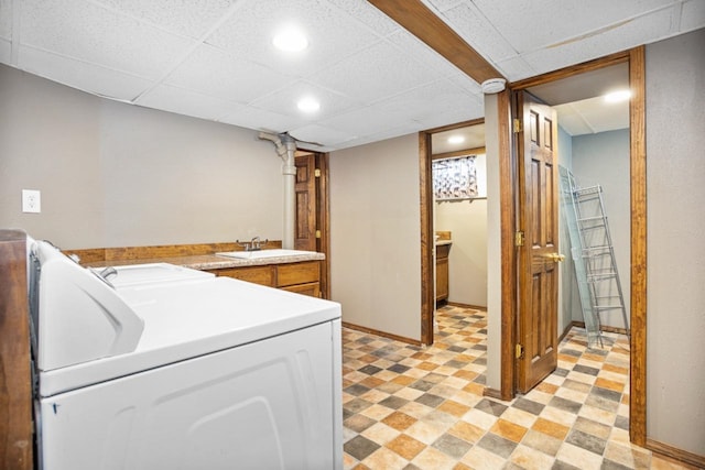 1309 1st St, Minot, ND 58701 - clothes washing area with recessed lighting, a sink, and light flooring