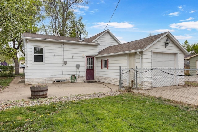 1309 1st St, Minot, ND 58701 - rear view of house featuring a shingled roof and a patio area