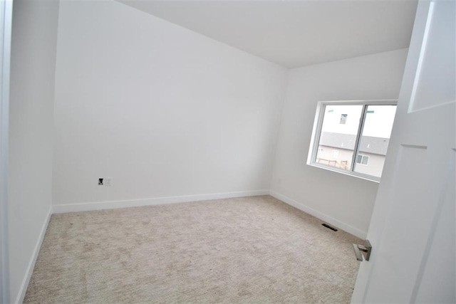 138 Mulberry Loop, Minot, ND 58703 - carpeted empty room featuring baseboards