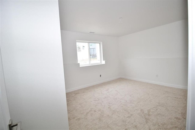 138 Mulberry Loop, Minot, ND 58703 - carpeted empty room with baseboards