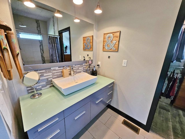 1007 5th St, Rugby, ND 58368 - bathroom with tasteful backsplash, a shower with curtain, vanity, tile patterned flooring, and baseboards