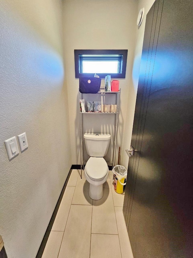 1007 5th St, Rugby, ND 58368 - bathroom featuring toilet and tile patterned floors
