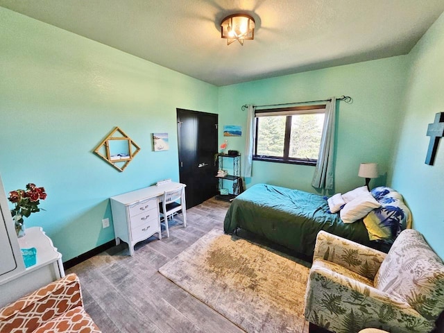 1007 5th St, Rugby, ND 58368 - bedroom featuring wood finished floors and baseboards