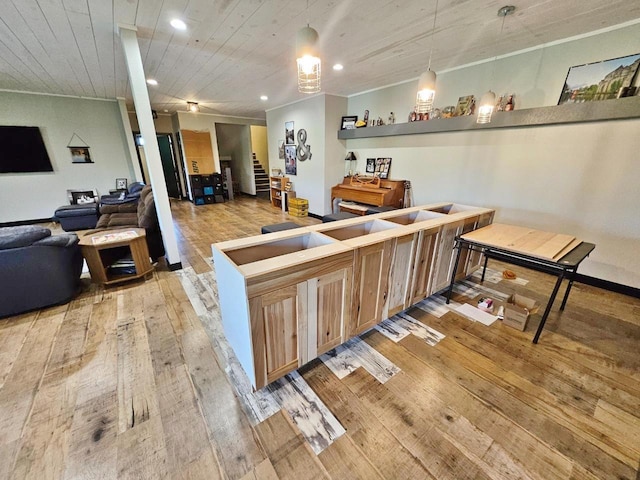 1007 5th St, Rugby, ND 58368 - kitchen with light wood-style floors, open floor plan, wood ceiling, pendant lighting, and light brown cabinets