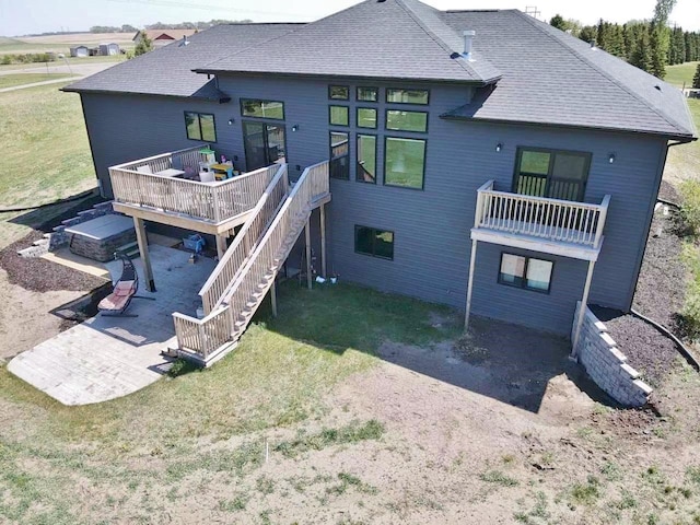 1007 5th St, Rugby, ND 58368 - back of house featuring a patio area, a yard, a wooden deck, and stairs