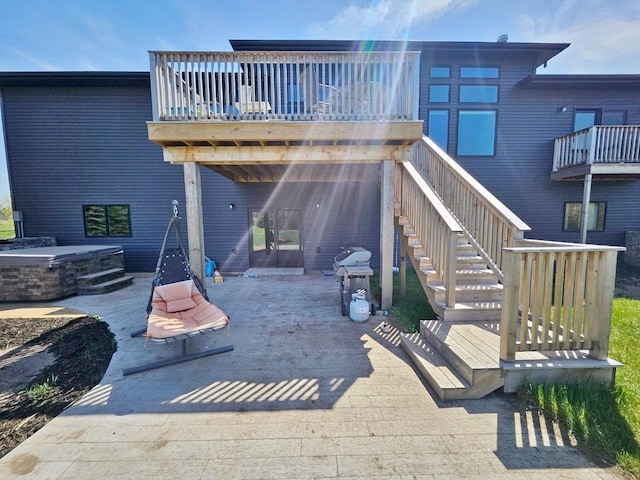 1007 5th St, Rugby, ND 58368 - back of property featuring a patio area, a deck, and stairs