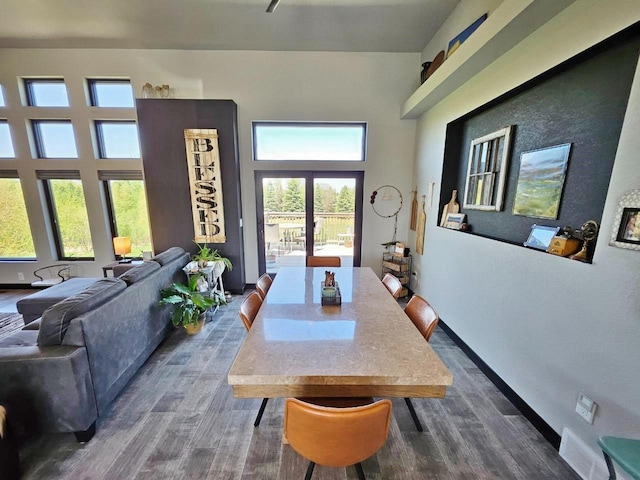 1007 5th St, Rugby, ND 58368 - dining room featuring dark wood-style flooring and baseboards