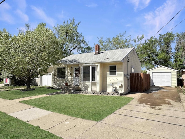 1201 Soo St, Minot, ND 58701 - bungalow-style house with an outbuilding, a chimney, driveway, and a garage
