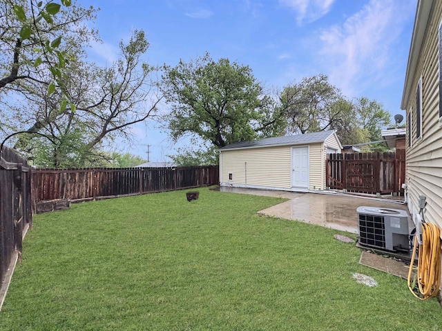 1201 Soo St, Minot, ND 58701 - view of yard featuring central AC, a patio area, and an outdoor structure