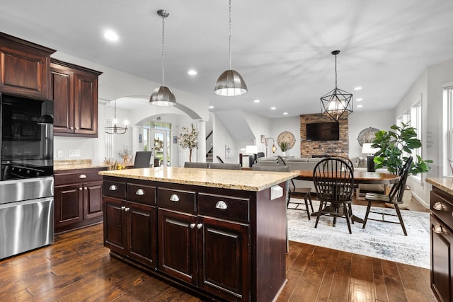 1804 Valley Bluffs Dr, Minot, ND 58701 - kitchen featuring healthy amount of natural light, smart refrigerator, dark wood-type flooring, arched walkways, and recessed lighting