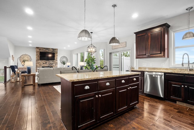 1804 Valley Bluffs Dr, Minot, ND 58701 - kitchen with dishwasher, a sink, a center island, dark wood-type flooring, and dark brown cabinetry