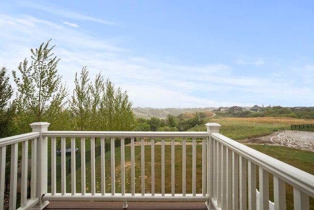 1804 Valley Bluffs Dr, Minot, ND 58701 - wooden deck featuring a lawn