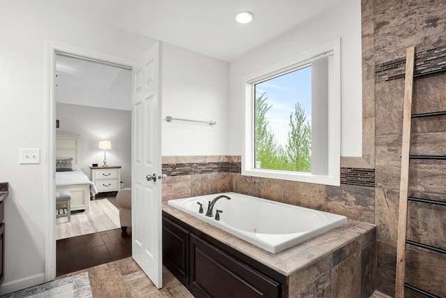 1804 Valley Bluffs Dr, Minot, ND 58701 - bathroom with connected bathroom and a bath
