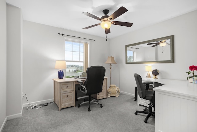 1804 Valley Bluffs Dr, Minot, ND 58701 - home office featuring ceiling fan, baseboards, and light colored carpet