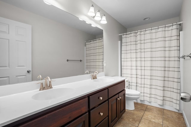 1804 Valley Bluffs Dr, Minot, ND 58701 - full bathroom with tile patterned flooring, double vanity, toilet, and curtained shower